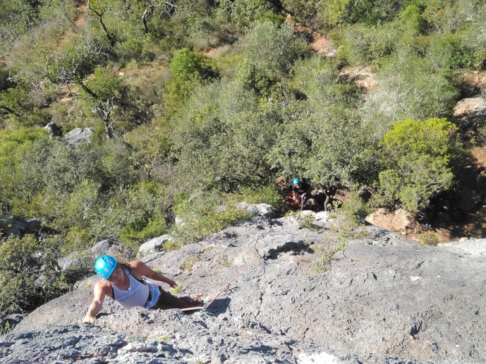 Climber taking a break and calculating the next move