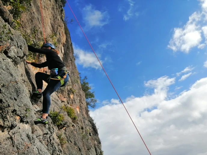 Climber half-way through a route at Rocha da Pena