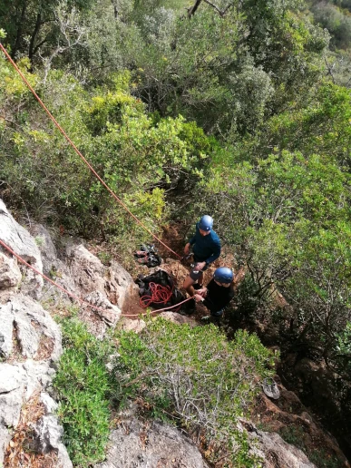 Climbers performing safety check at Rocha da Pena during a top rope course