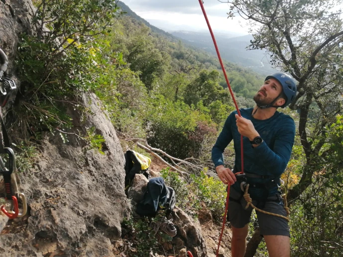 Climber belaying on top rope at Rocha da Pena