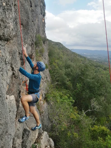 Climber enjoying a top rope climb at Rocha da Pena