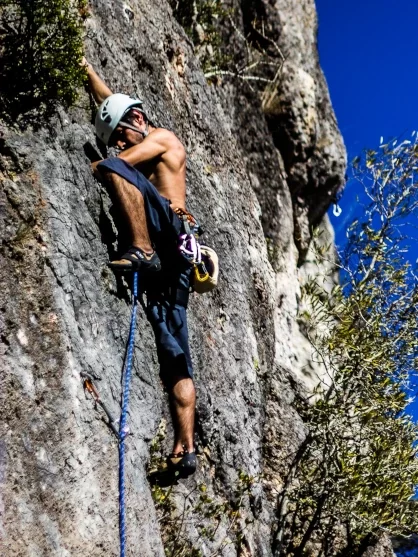 Climber leading one of the routes at Rocha da Pena, Portugal.